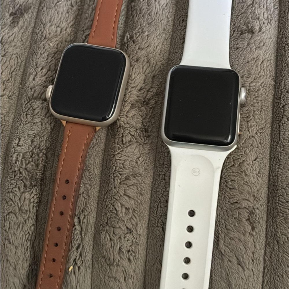 Apple Smartwatches with Brown Leather and White Sport Bands